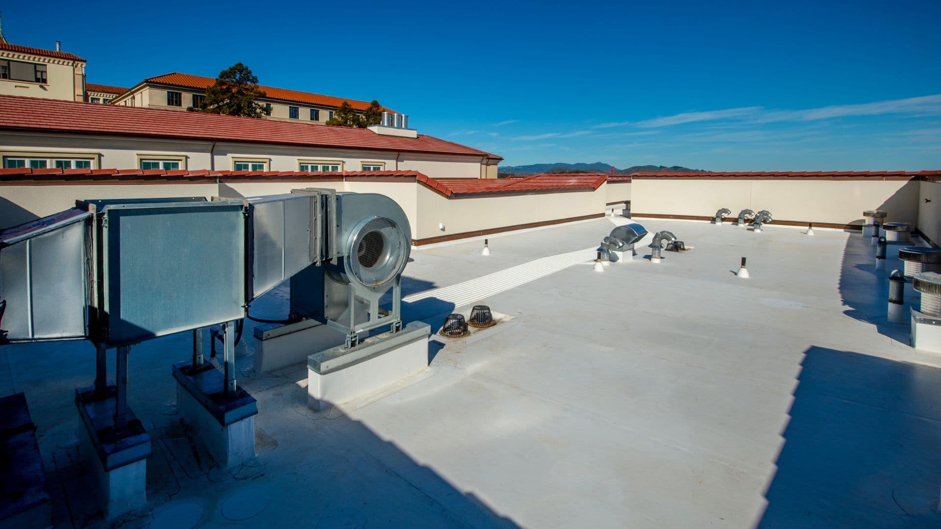 Commercial flat roof with rooftop HVAC units inspected by Modex
