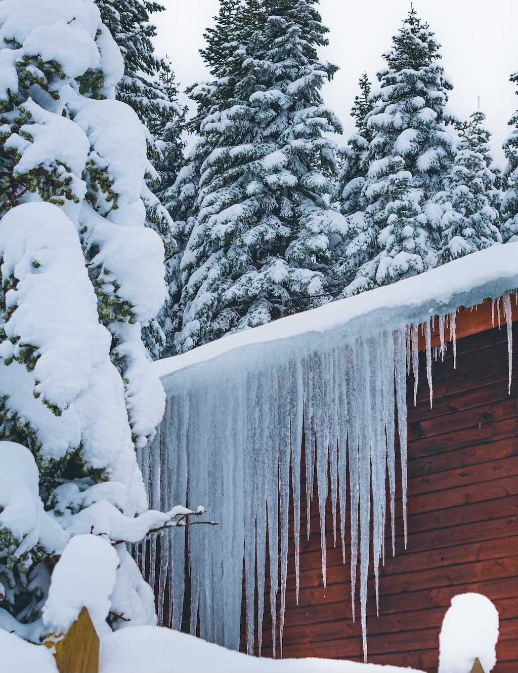 Ice dam and icicle formation on a Twin Cities roof in mid-winter — Modex steam-removal candidate