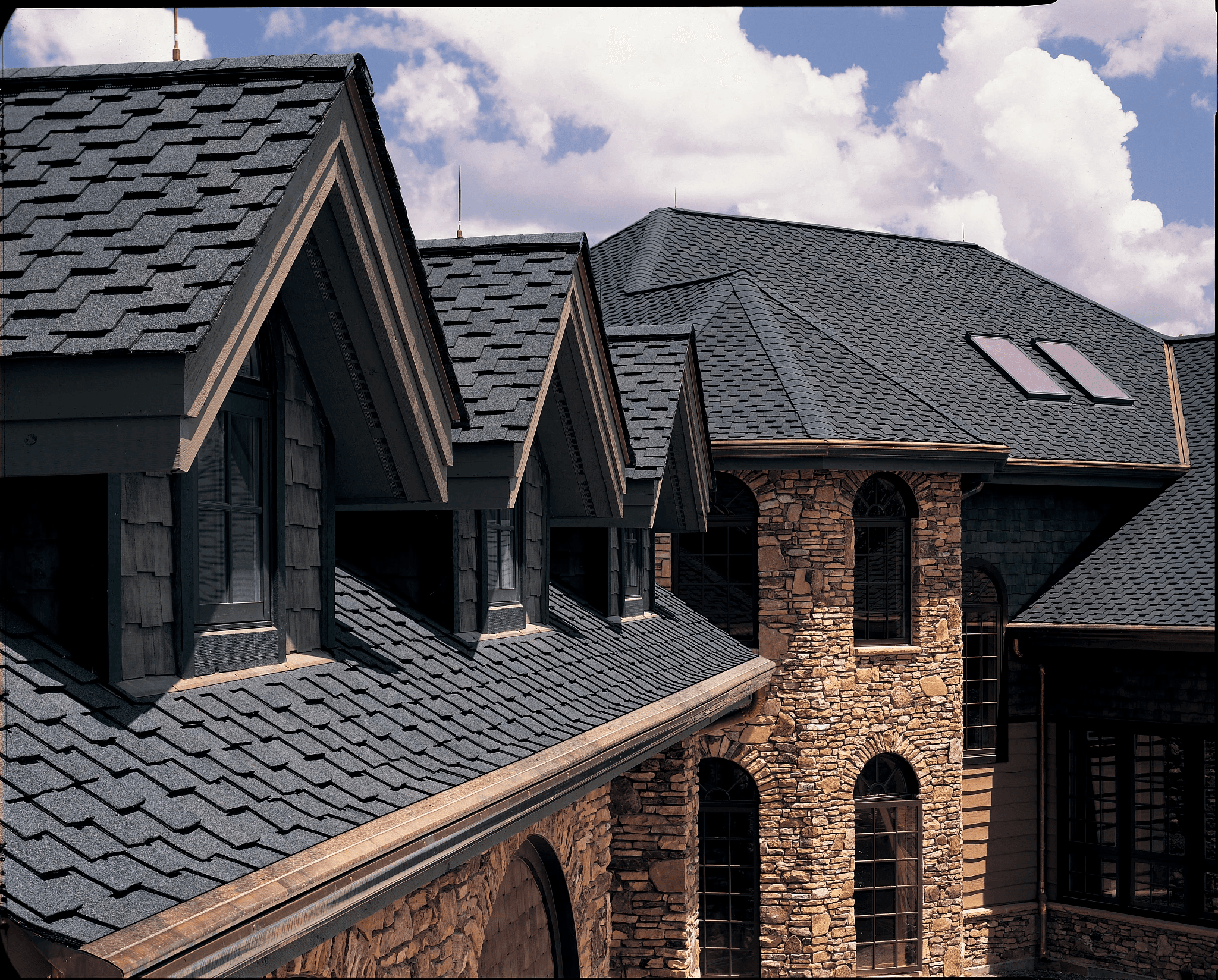 Orono stone home with CertainTeed Presidential Shake TL