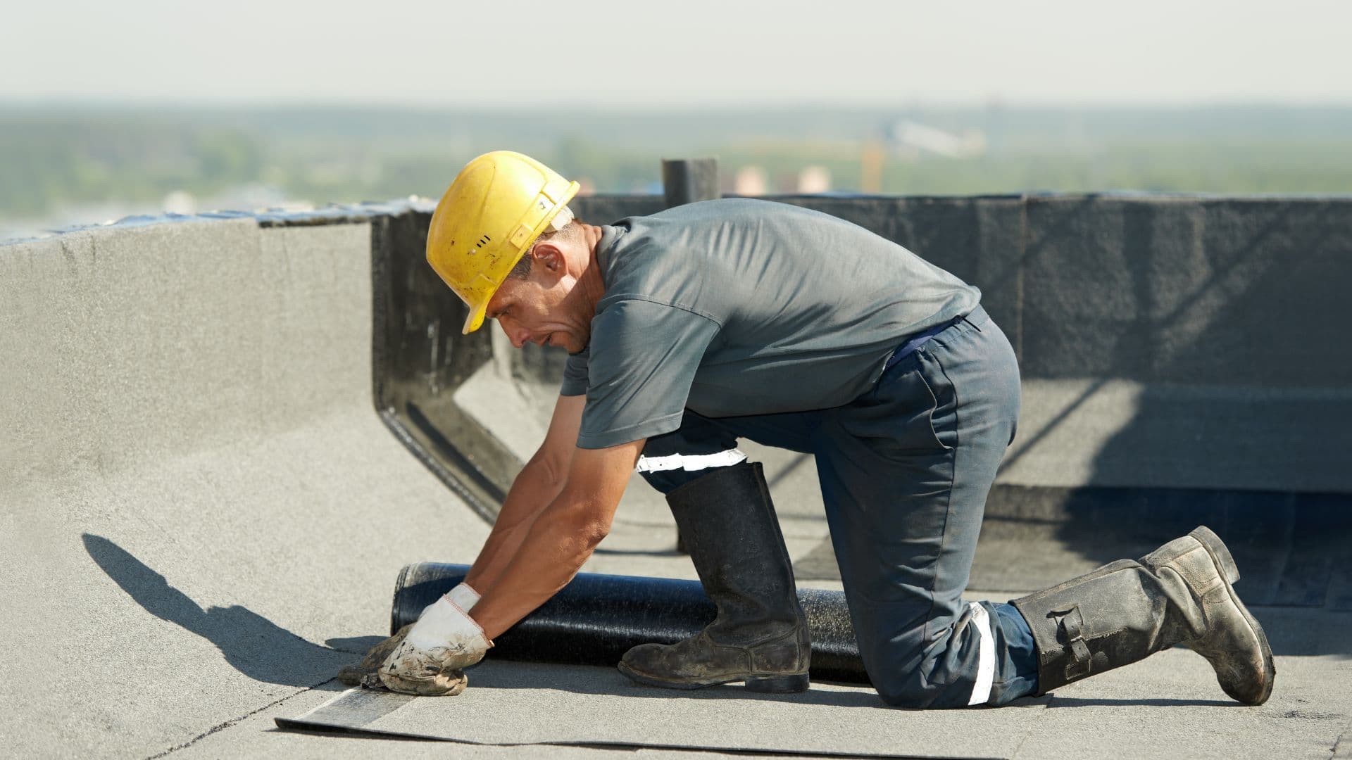Modified bitumen flat roofing being installed