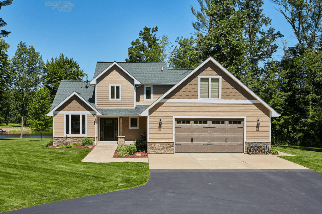 Finished siding system on a Twin Cities home — French Gray with white trim, installed by Modern Exterior Systems