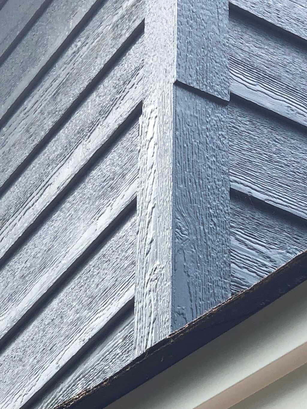 LP SmartSide gray engineered wood siding — the kind of in-production color that color-matches cleanly during a partial repair