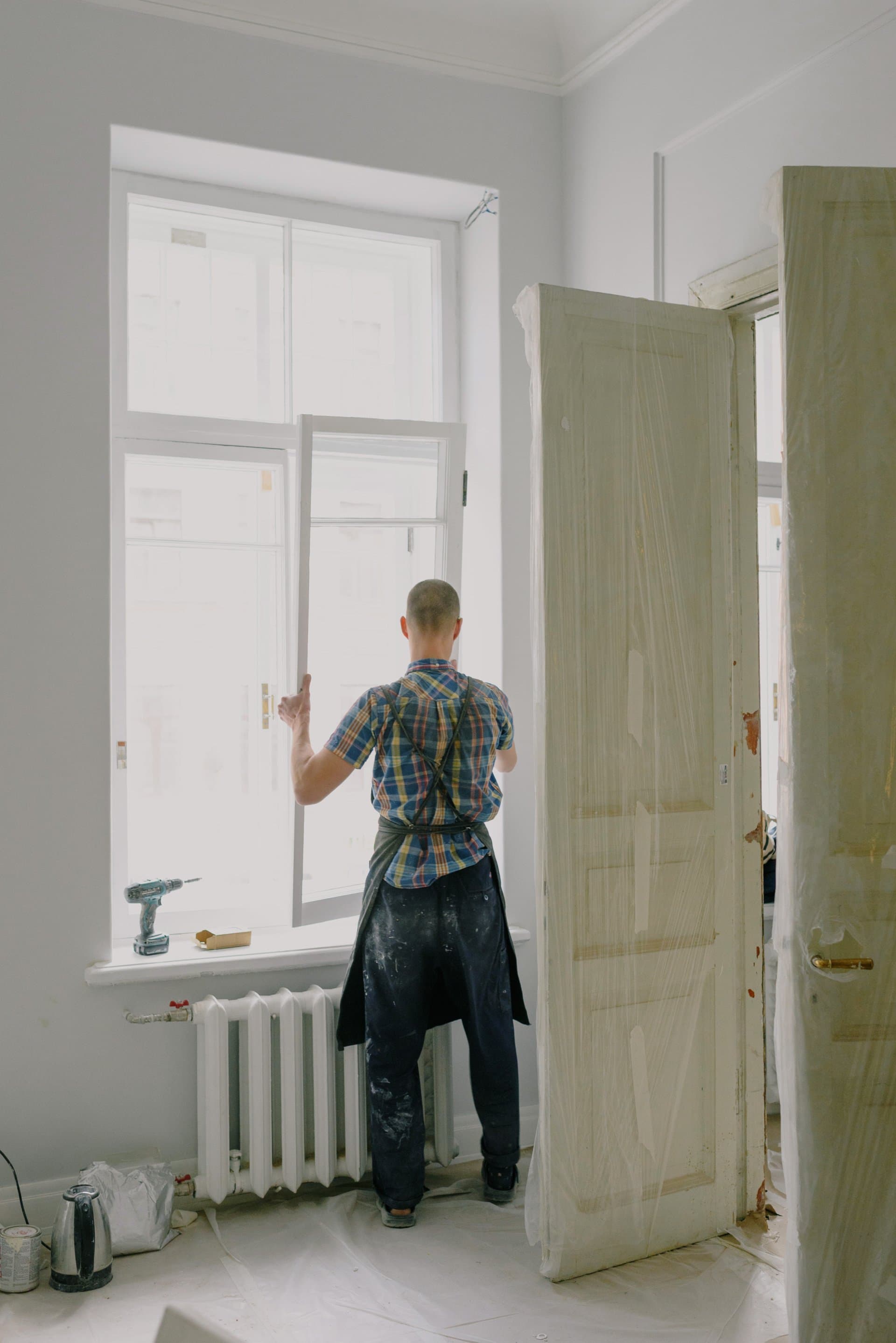 Modex installer on a Twin Cities window repair — frame inspection before quoting scope