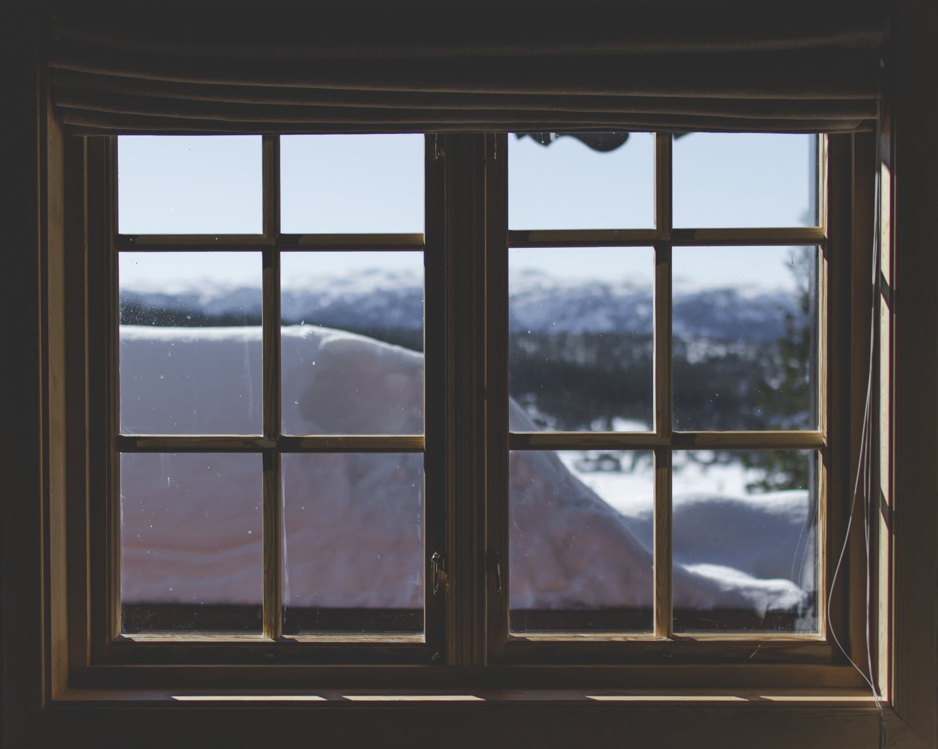 Twin Cities window in winter — failed weatherstripping shows up as drafts and condensation