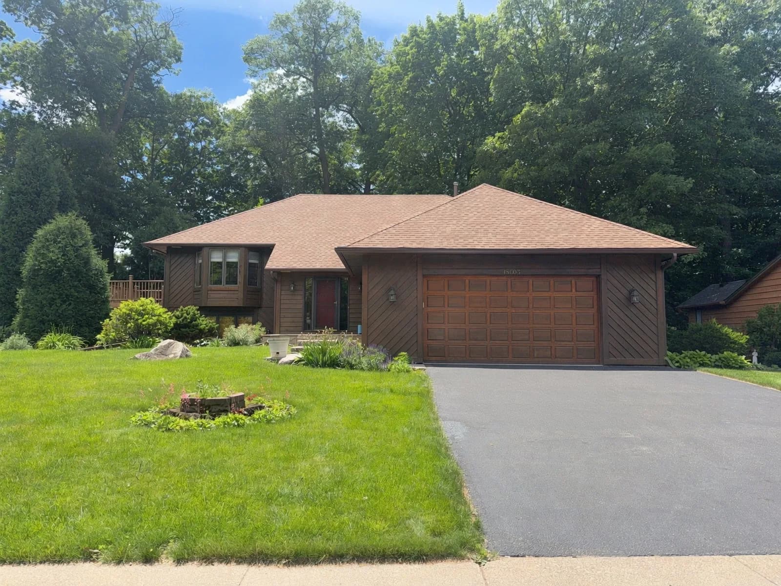 Twin Cities split-level home with original 1980s dark diagonal cedar siding, before exterior redesign