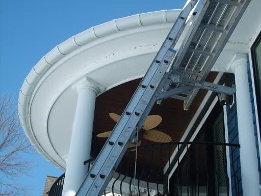 Eaves and fascia on a Minnesota home in winter, where ice dams and attic ventilation meet
