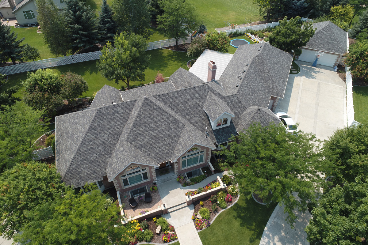 Malarkey architectural storm-grey aerial on a Fern Hill insurance roof