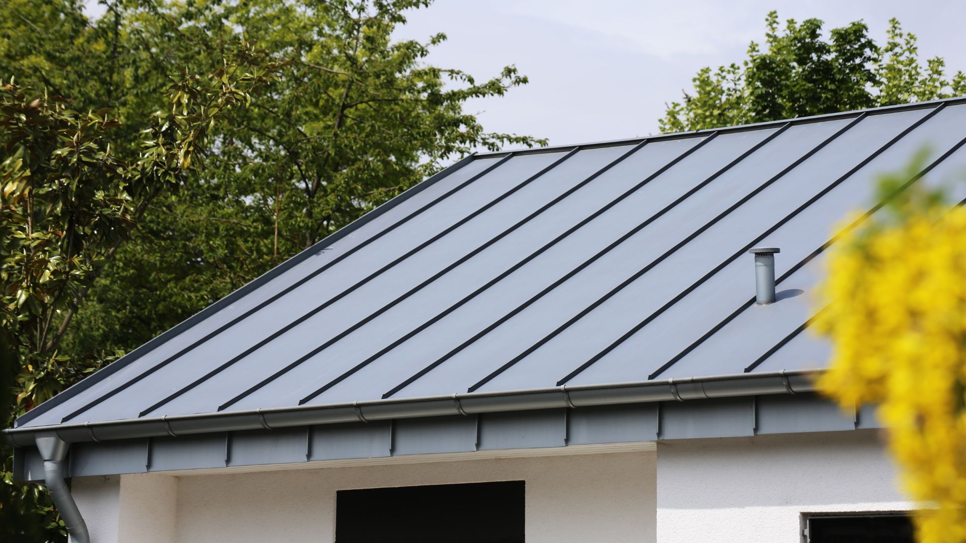 Standing seam metal roof on a modern Twin Cities custom home